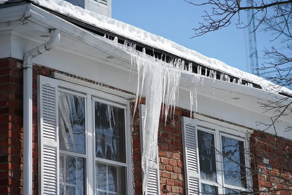 The Impact of Snow and Ice on Roofs and Gutters